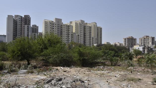 Residents have filled up the Sector 47 pond to create a shorter path between residential colonies in the sector. (Sanjeev Verma/HT PHOTO) Residents have filled up the Sector 47 pond to create a shorter path between residential colonies in the sector. (Sanjeev Verma/HT PHOTO)