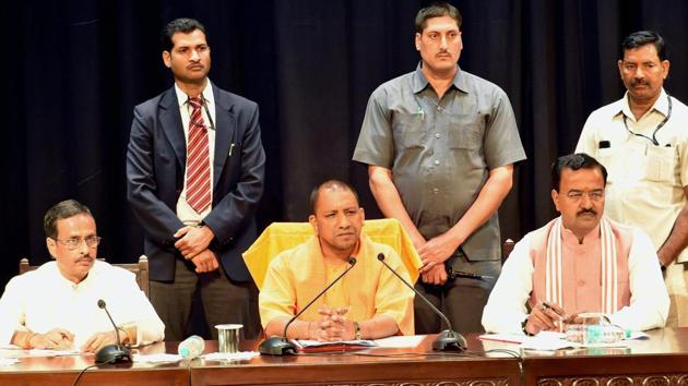 UP chief minister Yogi Aditya Nath with deputy CMs Dinesh Sharma and Keshav Prasad Maurya at a meeting of police officers at Lok Bhawan in Lucknow.(PTI Photo) UP chief minister Yogi Aditya Nath with deputy CMs Dinesh Sharma and Keshav Prasad Maurya at a meeting of police officers at Lok Bhawan in Lucknow.(PTI Photo)