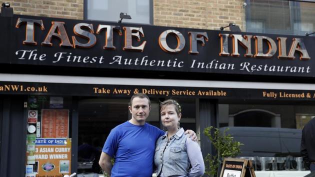 Polish engaged couple Pawel Bednarek, a builder, and Aga Pozniak, who teaches training courses for adults, pose for photographs outside where they work part-time to supplement their incomes, at the Taste of India curry restaurant in London on March 9, 2017. (AP Photo) Polish engaged couple Pawel Bednarek, a builder, and Aga Pozniak, who teaches training courses for adults, pose for photographs outside where they work part-time to supplement their incomes, at the Taste of India curry restaurant in London on March 9, 2017. (AP Photo)