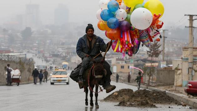 An Afghan man rides on his donkey, holding balloons for sale during Newroz Day celebrations, a festival marking their spring and new year, in Kabul, Afghanistan. (Omar Sobhani/REUTERS) An Afghan man rides on his donkey, holding balloons for sale during Newroz Day celebrations, a festival marking their spring and new year, in Kabul, Afghanistan. (Omar Sobhani/REUTERS)