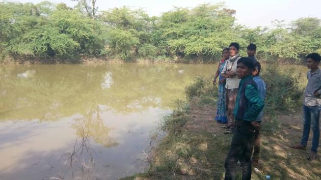 The pond in which two girls drowned on Tuesday during a police raid in Bharatpur.(HT Photo)