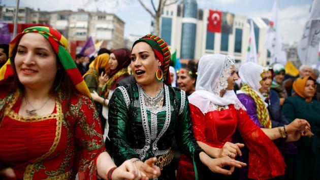 People gesture during a gathering celebrating Newroz, which marks the arrival of spring and the new year, in Istanbul, Turkey. (Osman Orsal/REUTERS) People gesture during a gathering celebrating Newroz, which marks the arrival of spring and the new year, in Istanbul, Turkey. (Osman Orsal/REUTERS)