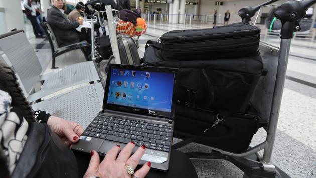 A woman checks her laptop at the Beirut international airport. The US and the UK have banned laptops and other devices on flights from some countries. (AFP) A woman checks her laptop at the Beirut international airport. The US and the UK have banned laptops and other devices on flights from some countries. (AFP)