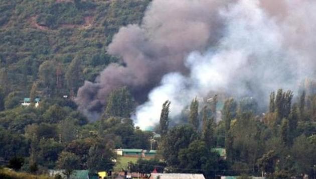 Smoke rises from the army base attacked by militants in the town of Uri, west of Srinagar on September 18. The NIA’s conclusion that the LeT carried out the Uri attack is based on the coded matrix sheets recovered from the neutralised attackers.(HT Photo)