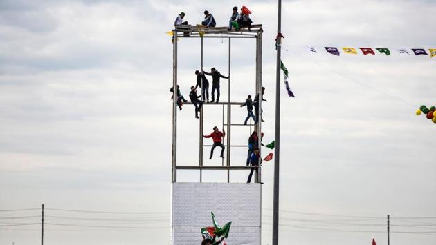 Young men climb on a during the celebrations. It was at the Diyarbakir Newroz celebrations in 2015 that the jailed leader of the outlawed Kurdistan Workers’ Party (PKK), Abdullah Ocalan, in a statement read by an MP, called for an end to its four-decade armed struggle against the Turkish state. (Bulent Kilic/AFP) Young men climb on a during the celebrations. It was at the Diyarbakir Newroz celebrations in 2015 that the jailed leader of the outlawed Kurdistan Workers’ Party (PKK), Abdullah Ocalan, in a statement read by an MP, called for an end to its four-decade armed struggle against the Turkish state. (Bulent Kilic/AFP)