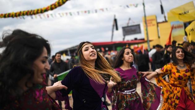 Women dance as Turkish Kurds during Newroz celebrations at Diyarbakir, southeastern Turkey. The annual event, which received official permission, took place under heavy security ahead of an April 16 referendum as the authorities pursue their fight against outlawed Kurdish militants. (Bulent Kilic/AFP) Women dance as Turkish Kurds during Newroz celebrations at Diyarbakir, southeastern Turkey. The annual event, which received official permission, took place under heavy security ahead of an April 16 referendum as the authorities pursue their fight against outlawed Kurdish militants. (Bulent Kilic/AFP)