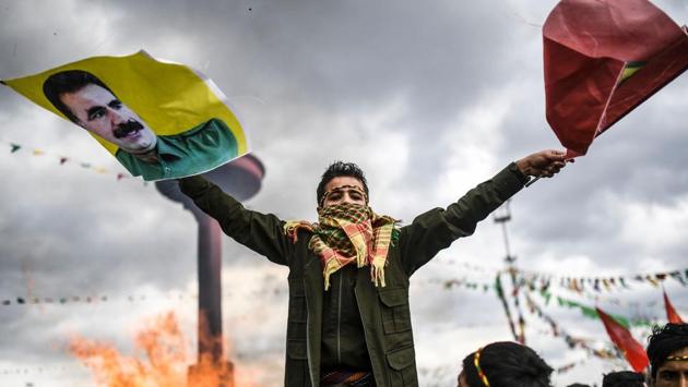 A Kurdish boy waves flags with a picture of jailed Kurdish leader Abdullah Ocalan during the celebrations of Newroz. (Bulent Kilic/AFP) A Kurdish boy waves flags with a picture of jailed Kurdish leader Abdullah Ocalan during the celebrations of Newroz. (Bulent Kilic/AFP)