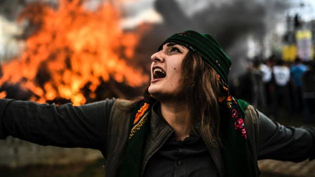 A Kurdish woman dances in front of a fire as Turkish Kurds gather for Newroz celebrations for the new year in Diyarbakir, southeastern Turkey. Newroz (also known as Nawroz or Nowruz) is an ancient Persian festival, which is also celebrated by Kurdish people, marking the first day of spring. (Bulent Kilic/AFP) A Kurdish woman dances in front of a fire as Turkish Kurds gather for Newroz celebrations for the new year in Diyarbakir, southeastern Turkey. Newroz (also known as Nawroz or Nowruz) is an ancient Persian festival, which is also celebrated by Kurdish people, marking the first day of spring. (Bulent Kilic/AFP)