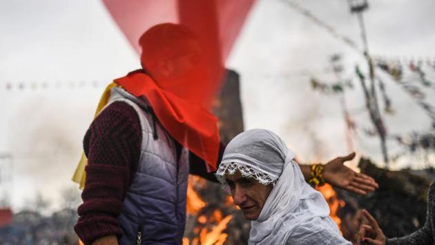 Turkish Kurds gather around a bonfire for Newroz celebrations for the new year in Diyarbakir, southeastern Turkey. (Bulent Kilic/AFP) Turkish Kurds gather around a bonfire for Newroz celebrations for the new year in Diyarbakir, southeastern Turkey. (Bulent Kilic/AFP)