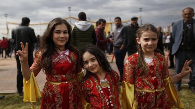 Children in traditional Kurdish clothing, pose for the photographer during the Newroz celebration, in Diyarbakir, southeastern Turkey. Thousands celebrated the Newroz festival in Istanbul and in Diyarbakir, a mainly Kurdish city in a region where Kurdish militants regularly clash with government forces. In Turkey, the spring festival traditionally serves as an occasion to demand more rights for the Kurdish minority. (Lefteris Pitarakis/AP) Children in traditional Kurdish clothing, pose for the photographer during the Newroz celebration, in Diyarbakir, southeastern Turkey. Thousands celebrated the Newroz festival in Istanbul and in Diyarbakir, a mainly Kurdish city in a region where Kurdish militants regularly clash with government forces. In Turkey, the spring festival traditionally serves as an occasion to demand more rights for the Kurdish minority. (Lefteris Pitarakis/AP)