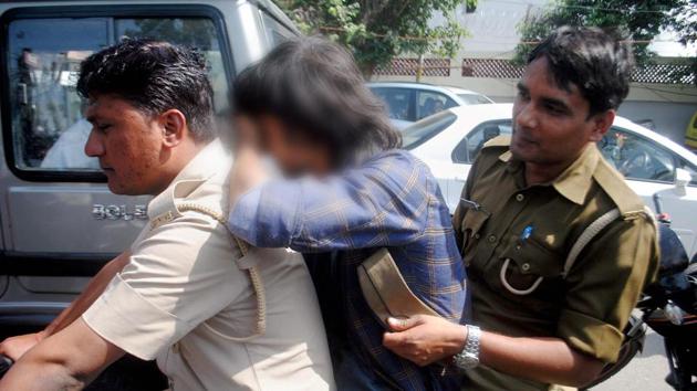 Uttar Pradesh police’s ‘anti-Romeo’ squad takes away a youth for interrogation, Lucknow, March 23(PTI)