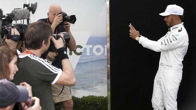 Mercedes driver Lewis Hamilton of Britain (right) captures the photographers at work during the profile shoot. One for Instagram, Mr. Hamilton? (AP) Mercedes driver Lewis Hamilton of Britain (right) captures the photographers at work during the profile shoot. One for Instagram, Mr. Hamilton? (AP)