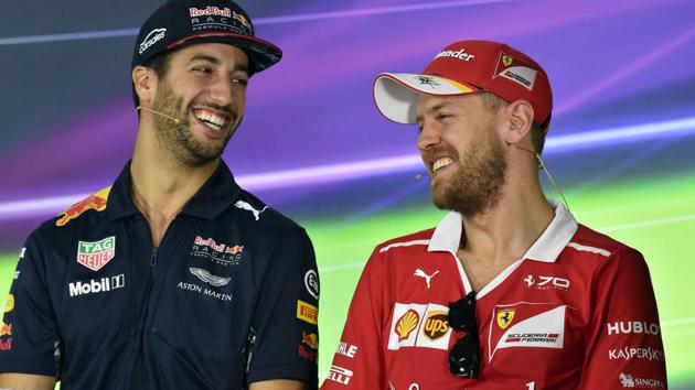 Ferrari Formula One team's German driver Sebastian Vettel (right) and Red Bull's Australian driver Daniel Ricciardo shares a light moment during the press interaction on Thursday, ahead of the Australian Grand Prix in Melbourne . (AFP) Ferrari Formula One team's German driver Sebastian Vettel (right) and Red Bull's Australian driver Daniel Ricciardo shares a light moment during the press interaction on Thursday, ahead of the Australian Grand Prix in Melbourne . (AFP)
