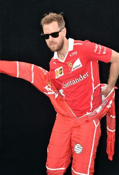Ferrari's German driver Sebastian Vettel caught in a last-minute wardrobe change during the photoshoot in Melbourne on Thursday. (AFP) Ferrari's German driver Sebastian Vettel caught in a last-minute wardrobe change during the photoshoot in Melbourne on Thursday. (AFP)
