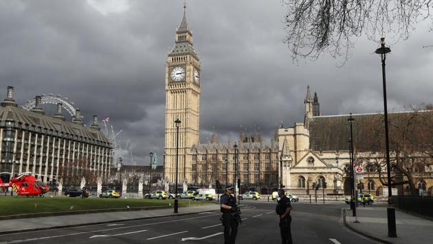Armed police officers stand guard outside the Houses of Parliament in London, Wednesday, March 23, 2017 after the House of Commons sitting was suspended as witnesses reported sounds like gunfire outside. (AP Photo) Armed police officers stand guard outside the Houses of Parliament in London, Wednesday, March 23, 2017 after the House of Commons sitting was suspended as witnesses reported sounds like gunfire outside. (AP Photo)