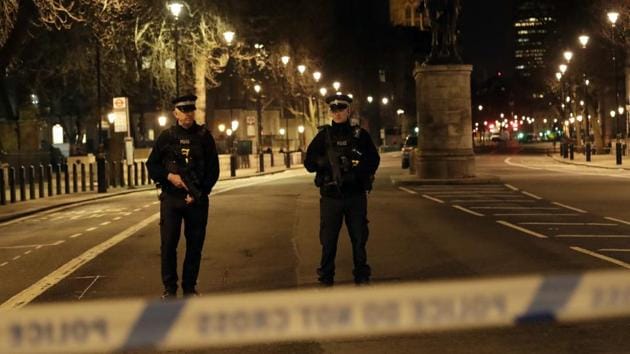 Two policemen stand guard at a cordoned off area on the way to the Houses of Parliament in central London, Wednesday, March 22, 2017. (AP) Two policemen stand guard at a cordoned off area on the way to the Houses of Parliament in central London, Wednesday, March 22, 2017. (AP)