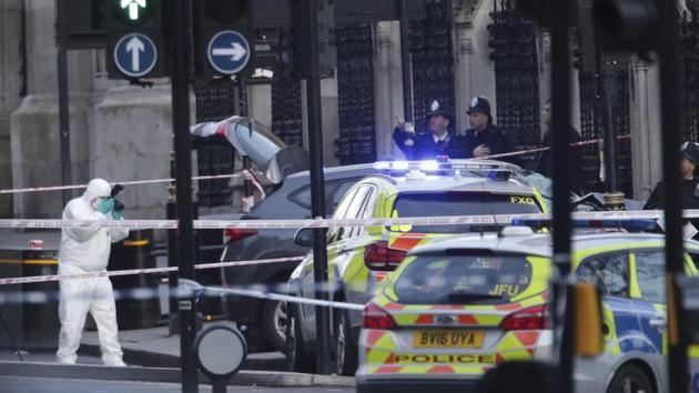 Police forensic officers at the scene close to the Houses of Parliament in London, Wednesday, March 22, 2017. (Yui Mok / AP)