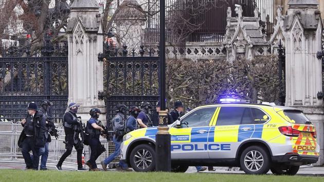 Armed police officers enter the Houses of Parliament in London, Wednesday, March 23, 2017 after the House of Commons sitting was suspended as witnesses reported sounds like gunfire outside. (Kirsty Wigglesworth / AP)