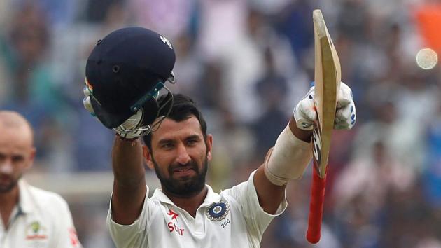 Cheteshwar Pujara celebrates his double century against Australia in Ranchi.(BCCI)