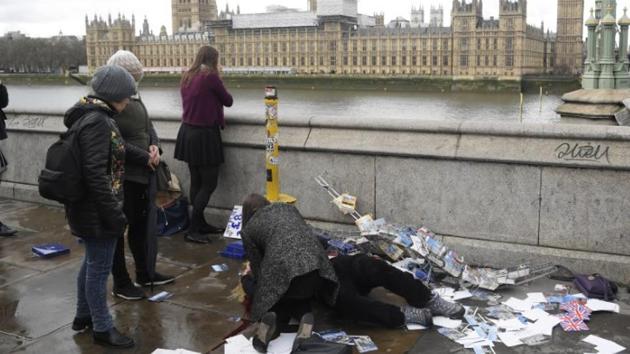An injured woman is assisted after an attack on Westminster Bridge in London. (Reuters) An injured woman is assisted after an attack on Westminster Bridge in London. (Reuters)