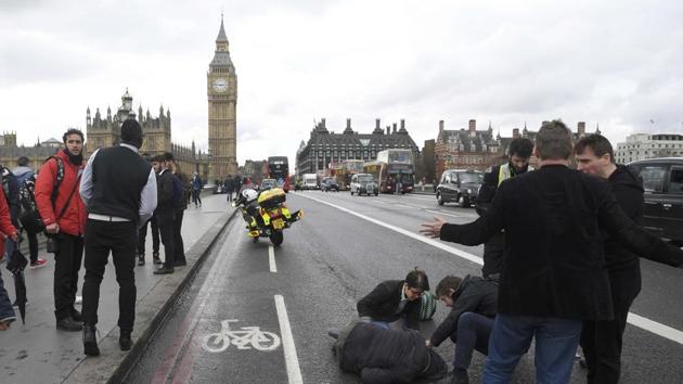 An injured person is assisted after the incident on Westminster Bridge in London, March 22. The shock of this attack was less about the casualties – luckily far fewer than earlier jihadi actions in Paris, Brussels and Nice – than the symbolic value of the target: Britain’s Parliament building at a time when both its prime minister and its parliamentarians were in session. (REUTERS) An injured person is assisted after the incident on Westminster Bridge in London, March 22. The shock of this attack was less about the casualties – luckily far fewer than earlier jihadi actions in Paris, Brussels and Nice – than the symbolic value of the target: Britain’s Parliament building at a time when both its prime minister and its parliamentarians were in session. (REUTERS)
