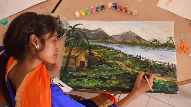 A student participating in a painting contest during the inter college cultural fest at Saint Soldier College, in Jalandhar. (Sikander Singh Chopra/Hindustan Times )