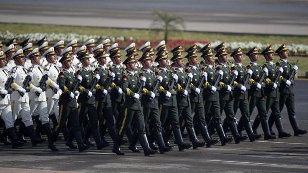 Chinese troops march during a Pakistan Day military parade in Islamabad on March 23. Pakistan National Day commemorates the passing of the Lahore Resolution, when a separate nation for the Muslims of the British Indian Empire was demanded.(AFP)