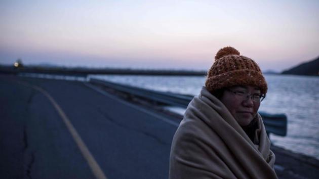 Lee Keum-Hui, whose daughter Cho Eun-Hwa was a victim of the Sewol ferry disaster and is still unaccounted for, walking to a makeshift home where she lives at Paengmok harbour on the southern island of Jindo. (Ed Jones/AFP) Lee Keum-Hui, whose daughter Cho Eun-Hwa was a victim of the Sewol ferry disaster and is still unaccounted for, walking to a makeshift home where she lives at Paengmok harbour on the southern island of Jindo. (Ed Jones/AFP)