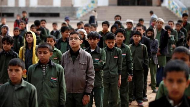 Boys take part in a morning drill at The al-Shawkani Foundation. (Khaled Abdullah / Reuters) Boys take part in a morning drill at The al-Shawkani Foundation. (Khaled Abdullah / Reuters)