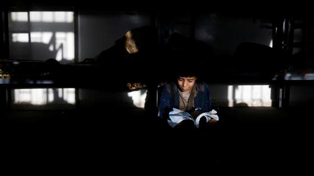 A boy studies in a dorm of The al-Shawkani Foundation. (Khaled Abdullah / Reuters) A boy studies in a dorm of The al-Shawkani Foundation. (Khaled Abdullah / Reuters)