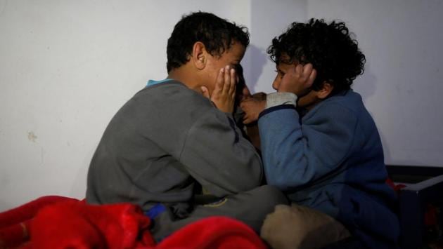 Boys chat before they go to bed at The al-Shawkani Foundation for Orphans Care . (Khaled Abdullah / Reuters) Boys chat before they go to bed at The al-Shawkani Foundation for Orphans Care . (Khaled Abdullah / Reuters)