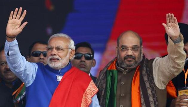 Prime Minister Narendra Modi (left) and Amit Shah, the Bharatiya Janata Party president, wave to their supporters during a rally in this file photo.(Reuters File Photo)