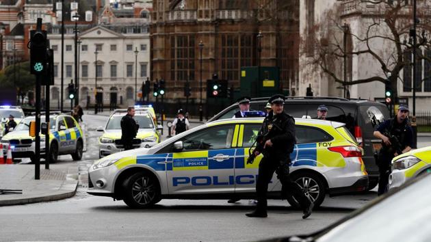 London police say they are treating a gun and knife incident at Britain's Parliament "as a terrorist incident until we know otherwise." The Metropolitan Police says in a statement that the incident is ongoing. It is urging people to stay away from the area. Officials say a man with a knife attacked a police officer at Parliament and was shot by officers. Nearby, witnesses say a vehicle struck several people on the Westminster Bridge. (Stefan Wermuth / REUTERS)