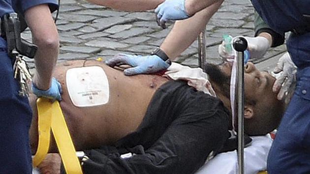 Attacker Khalid Masood is treated by emergency services outside the Houses of Parliament in London. (AP Photo) Attacker Khalid Masood is treated by emergency services outside the Houses of Parliament in London. (AP Photo)
