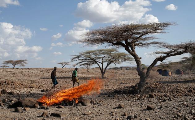 A Turkana tribesman walks in front of burned goats' carcasses in a village near Loiyangalani. (Goran Tomasevic / Reuters) A Turkana tribesman walks in front of burned goats' carcasses in a village near Loiyangalani. (Goran Tomasevic / Reuters)