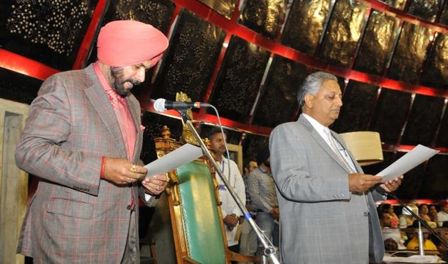 Local bodies and culture minister Navjot Singh Sidhu being administered the oath as MLA by pro-tem speaker Rana KP Singh on the first day of the maiden session of the 14th assembly of Punjab on Friday, March 24. (Keshav Singh/HT)
