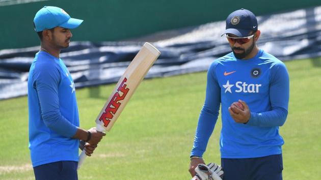 Shreyas Iyer (L) speaks with captain Virat Kohli during a training session on the eve of fourth Test match against Australia. (AFP) Shreyas Iyer (L) speaks with captain Virat Kohli during a training session on the eve of fourth Test match against Australia. (AFP)