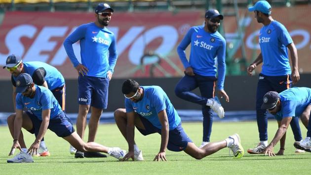 Virat Kohli (3rd L) warms up with teammates during the training session. (AFP) Virat Kohli (3rd L) warms up with teammates during the training session. (AFP)
