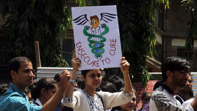Doctors outside KEM Hospital in Mumbai. (BHUSAN KOYANDE)
