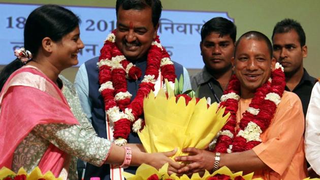 Uttar Pradesh chief minister Yogi Adityanath and his deputy Keshav Prasad Maurya during the swearing-in ceremony on Sunday.(AFP photo)