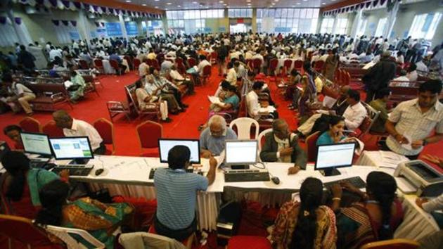 Taxpayers wait to file their income tax returns for the previous financial year at special counters set up by the income tax department in Bangalore in this file photo from 3013. (AP Photo) Taxpayers wait to file their income tax returns for the previous financial year at special counters set up by the income tax department in Bangalore in this file photo from 3013. (AP Photo)