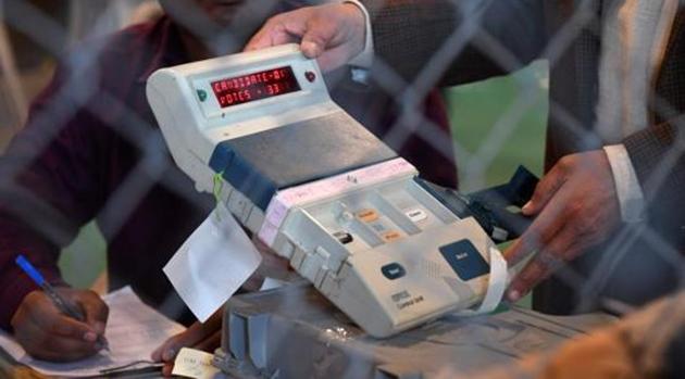 An election official shows an open Electronic Voting Machine (EVM) to political agents at a counting centre in Ghaziabad on March 11. (AFP File Photo) An election official shows an open Electronic Voting Machine (EVM) to political agents at a counting centre in Ghaziabad on March 11. (AFP File Photo)