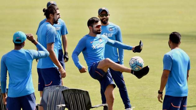 Virat Kohli with teammates during a practice session at HPCA Stadium in Dharamsala. (PTI) Virat Kohli with teammates during a practice session at HPCA Stadium in Dharamsala. (PTI)