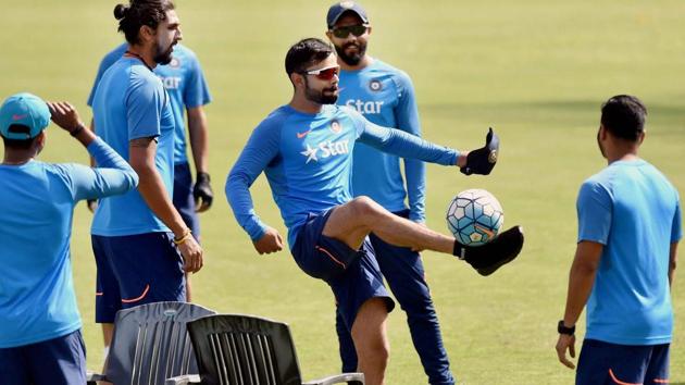 India cricket team captain Virat Kolhi had a relaxed training session in Dharamsala on Friday with doubts lingering about the condition of his injured shoulder.(PTI)