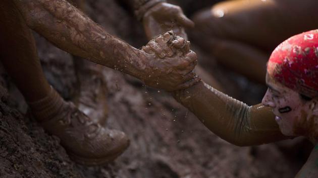 Among the attendees were the mayor of Tel Aviv, Ron Huldai, and French ambassador Helene Le Gal, though a picture posted on Twitter showed them both distinctly mud-free. (Oded Balilty/AP)