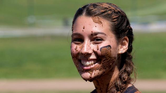 A participant smiles for the camera during the first Mud Day obstacle course race in Tel Aviv, Israel. (Baz Ratner/Reuters)