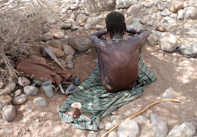 A sick Turkana tribesman sits in the bush in a village near Loiyangalani. (Goran Tomasevic / Reuters) A sick Turkana tribesman sits in the bush in a village near Loiyangalani. (Goran Tomasevic / Reuters)