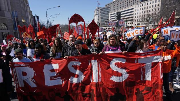 Health care activists march to the Trump International hotel during a protest on March 23, 2017 in Washington, DC.(AFP Photo) Health care activists march to the Trump International hotel during a protest on March 23, 2017 in Washington, DC.(AFP Photo)