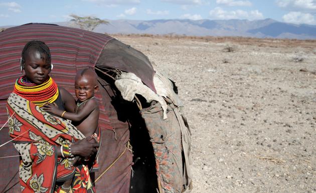 A Turkana tribeswoman holds her child in a village near Loiyangalani. (Goran Tomasevic / Reuters) A Turkana tribeswoman holds her child in a village near Loiyangalani. (Goran Tomasevic / Reuters)