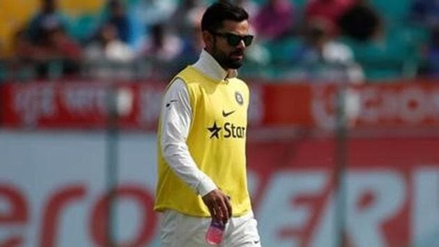 Virat Kohli walks of the field after a drinks break during the first day of the fourth and final Test between India and Australia in Dharamsala on Saturday.(Reuters)